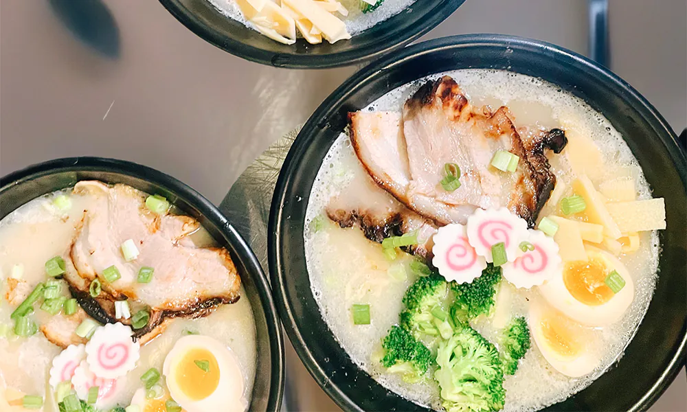 Creamy tonkotsu ramen with pork & soft-boiled egg at Hau'oli Poke Burritos & Bowls, a Japanese Restaurant in Sherman